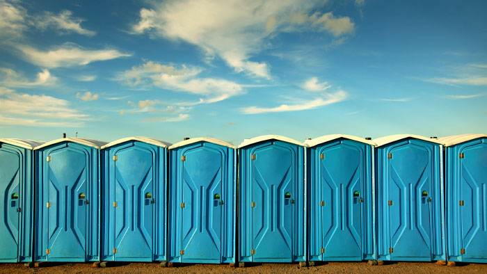 Image Of A Set Of Port A Potties At An Endurance Race That Encourages Athletes To Consider How To Hydrate Before A Race