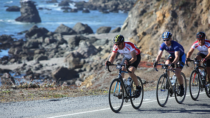 Cyclist On Coastal Bike Path With A Buddy Preparing For A Century Ride