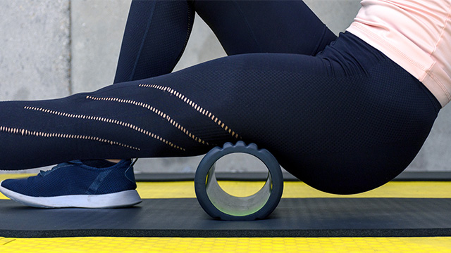 Woman Using A Foam Roll After A Workout