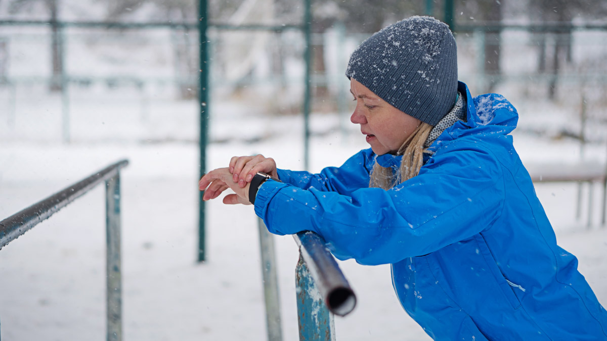 Woman Checking Watch During Training