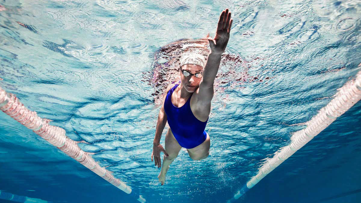 Image Of A Female Swimmer Doing Open Water Swimming Drills In A Pool