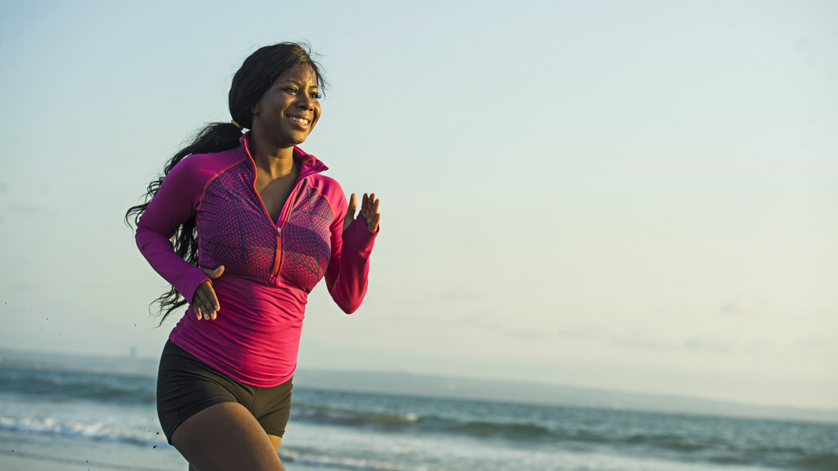 Female Runner At The Beach