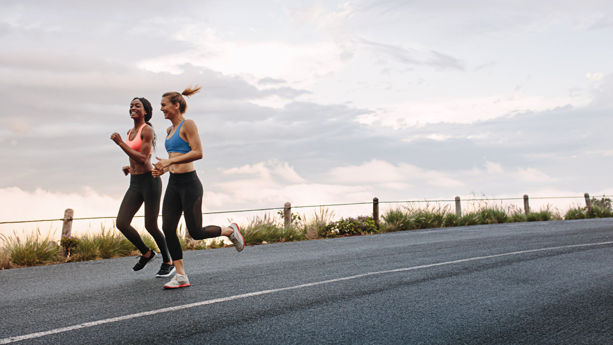 Two Women Athletes Running