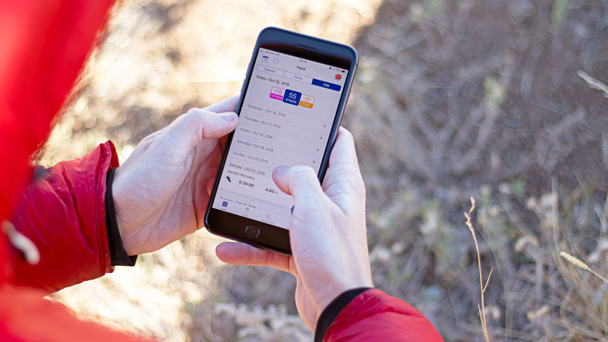 Athlete In Red Hoodie Using The Trainingpeaks App