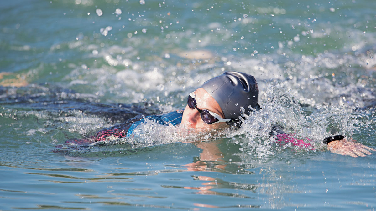 Female Triathlon Swimmer Trains For An Aquabike Race In A Pool