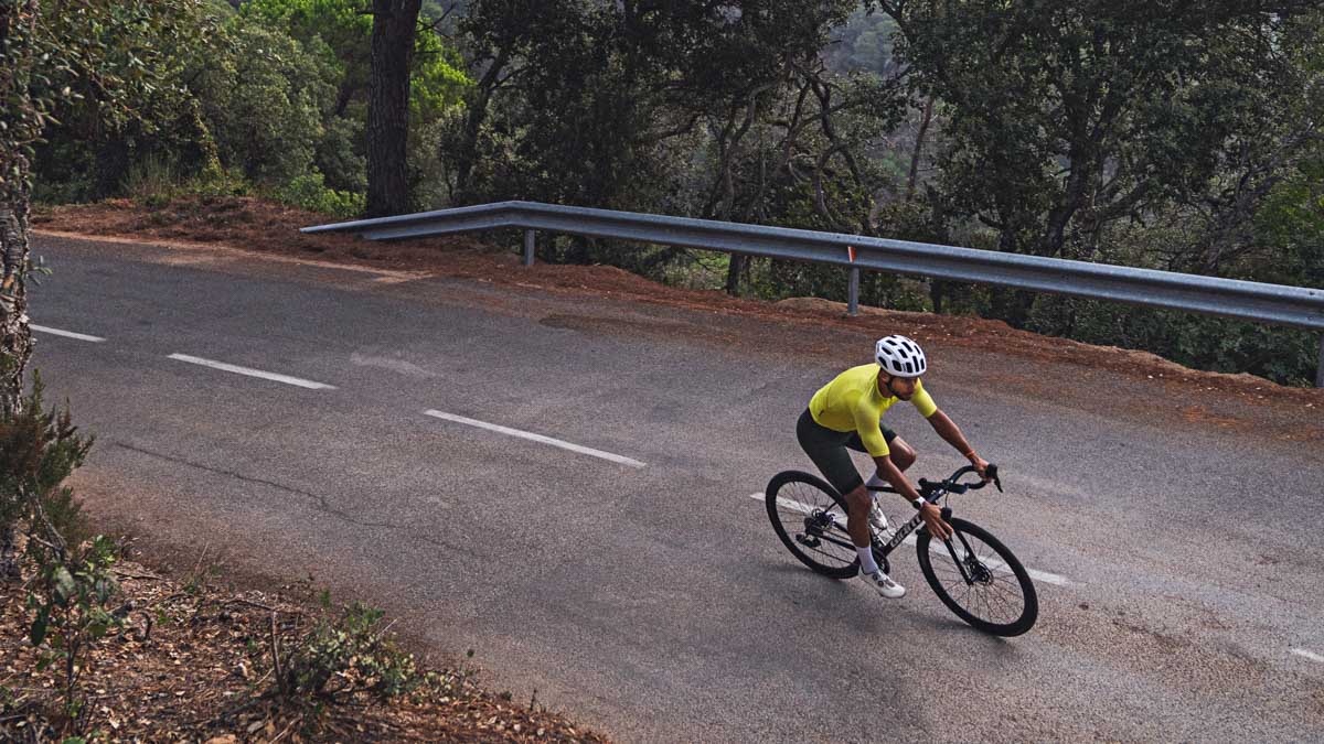 Image Of A Cyclist On A Bicycle On A Forest Road Wearing Yellow Jersey Doing Zone 2 Training For Ftp