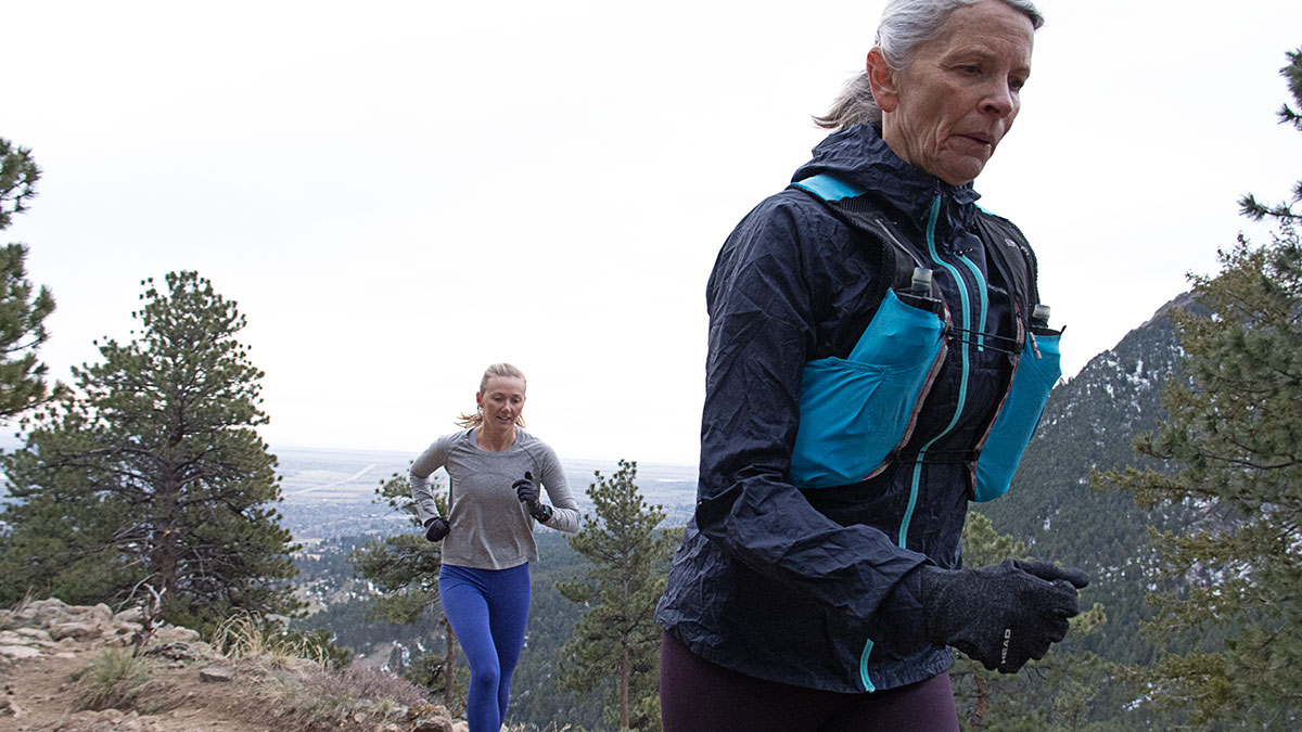 Two Women Endurance Athletes Running In The Mountains At Altitude