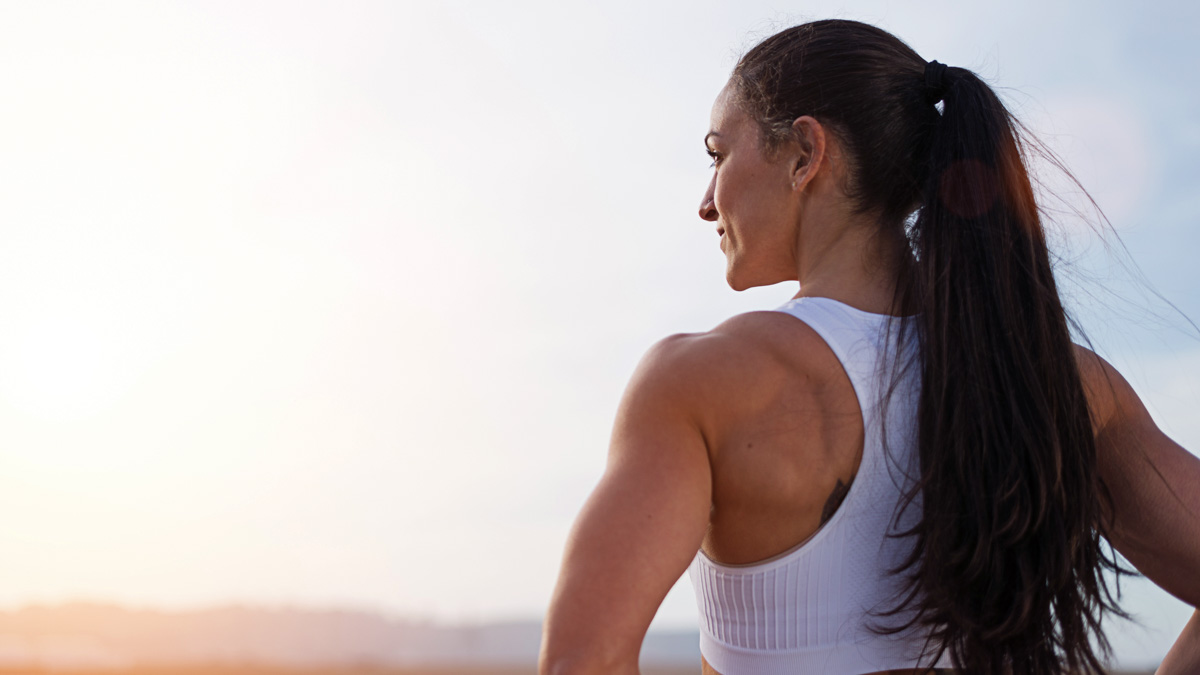 Image Of A Strong Young Woman Looking Out On The Horizon As She Learns More About Her Menstruation Cycle And Training