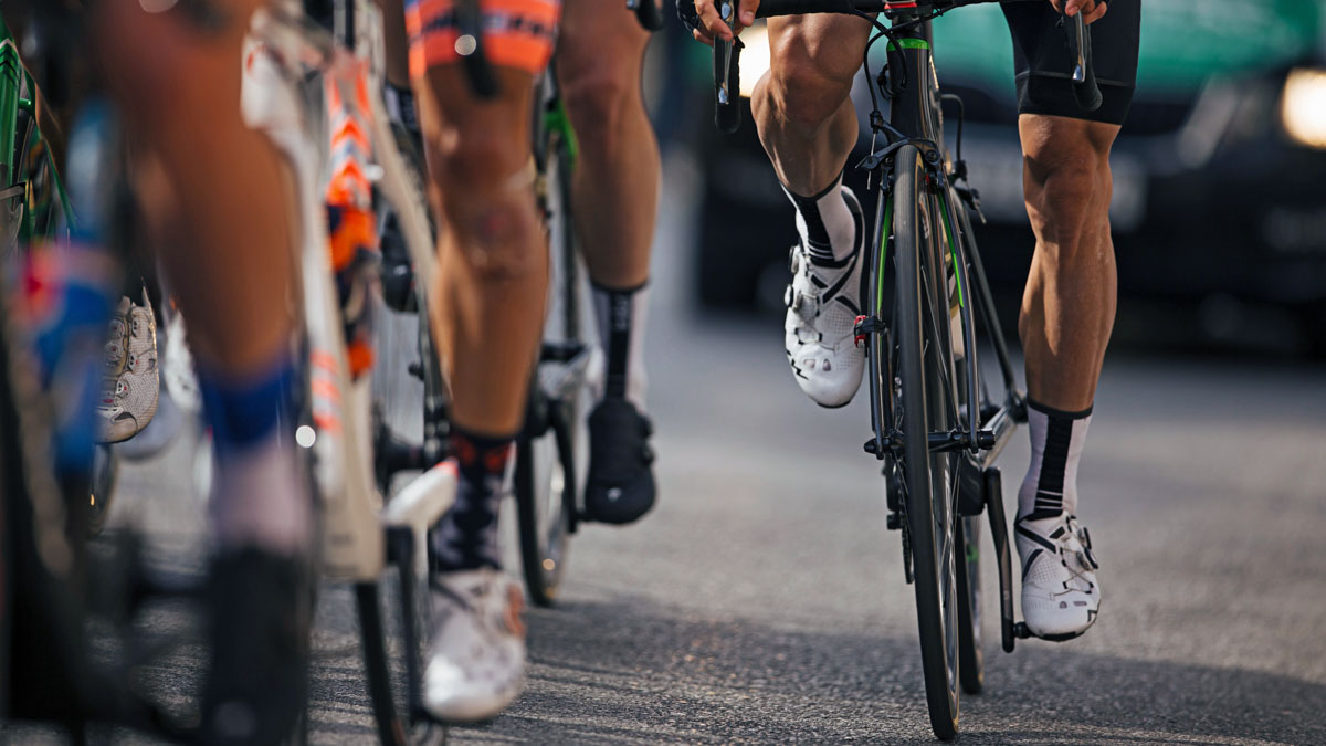View Of Professional Cyclists' Legs In A Race