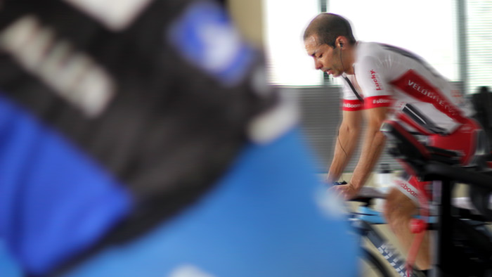 Image Of Two Male Cyclists Doing Bike Trainer Workouts