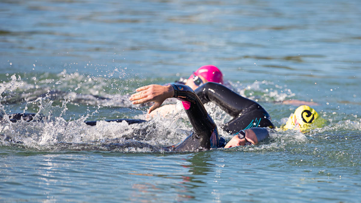 Open Water Swimmers Swimming In An Ironman Race After Preparing With An Ironman Training Plan