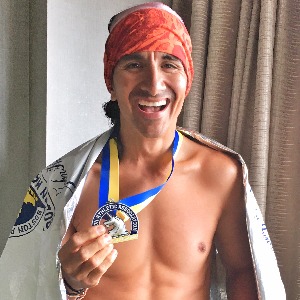 Image Of Trainingpeaks Coach Frank Campo With An Ironman Medal After Finishing An Ironman Race And Training