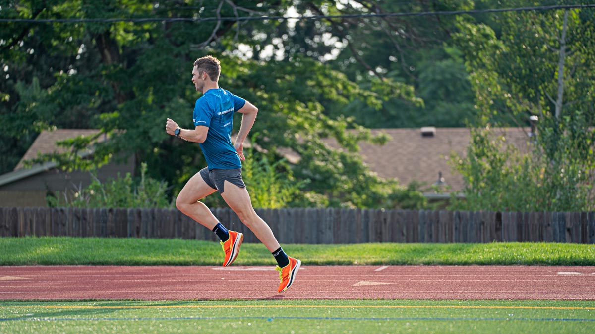 A Male Running During A Workout On A Track