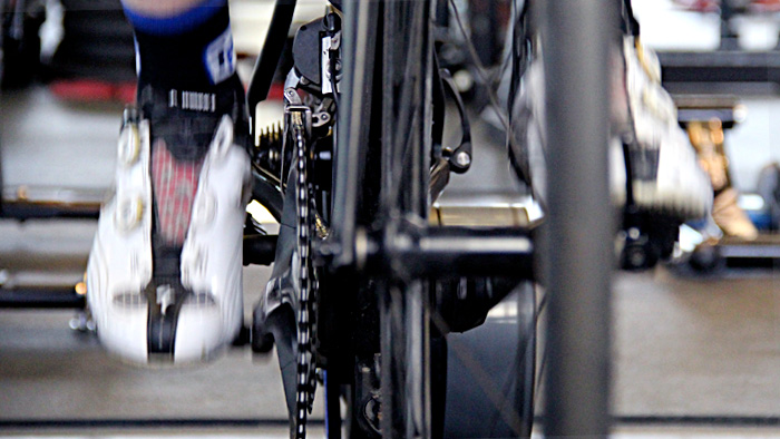 Image Of A Cyclist's Cleats Pedaling On An Indoor Trainer