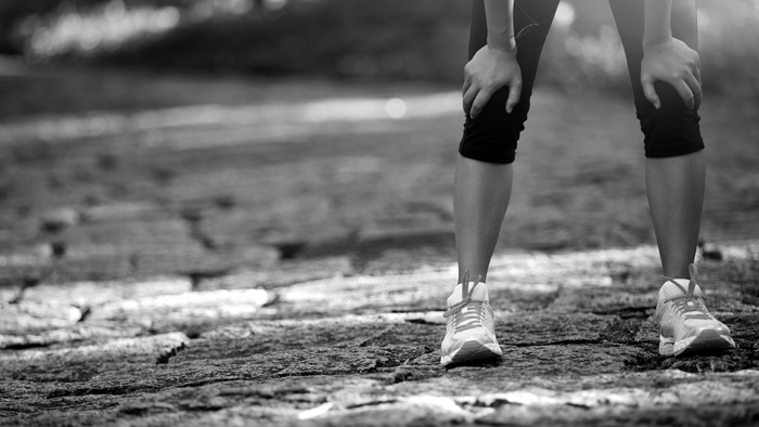 Image Of An Athlete In Black And White Taking A Break From Running And Avoiding Goal Setting Mistakes