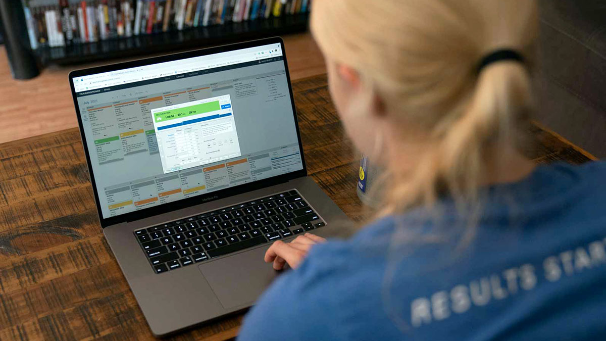 A Coach Using Trainingpeaks On Her Laptop In Her Home Office