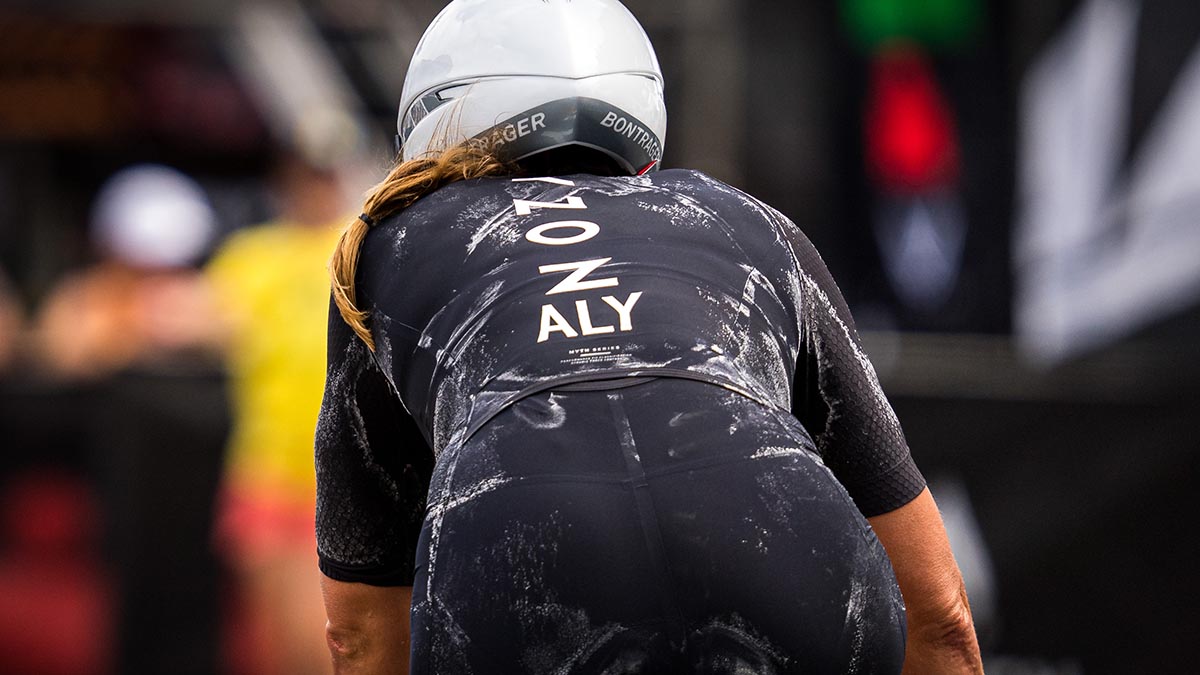 A Detail Of The Skinsuit Of A Triathlete Caked In Sweat Stains As She Enters T2 Of A Race.