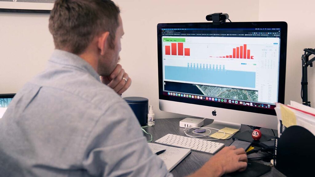 a coach reviewing metrics within the trainingpeaks app on a desktop computer