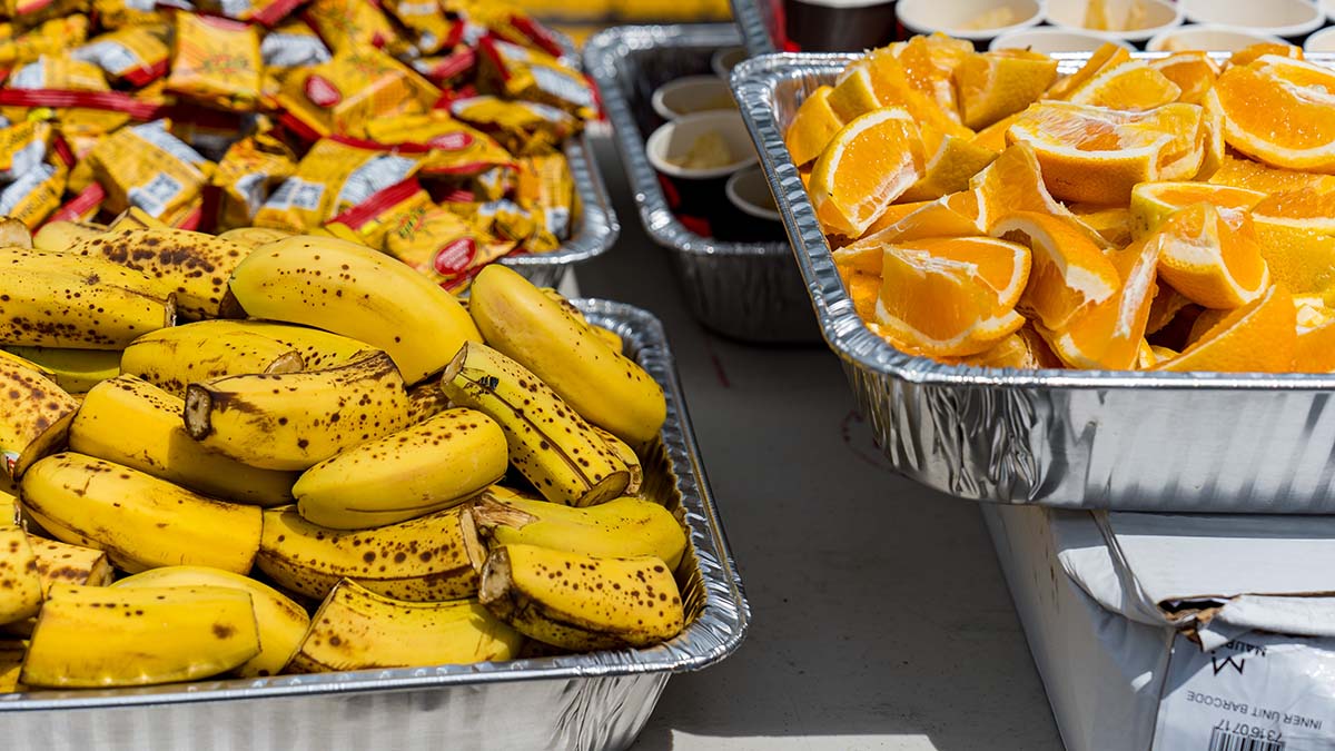 Bananas, Oranges And Sports Nutrition Sits On The Table Of An Aid Station During A Triathlon Race