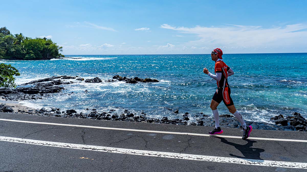A Male Runner On The Road Next To The Ocean During The Ironman World Championships Hawaii 2022