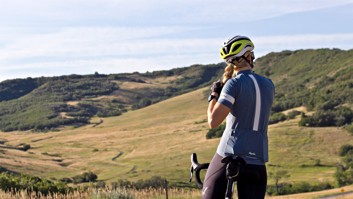 Image Of A Female Cyclist Looking Out On Rolling Hills Practicing Effective Goal Setting