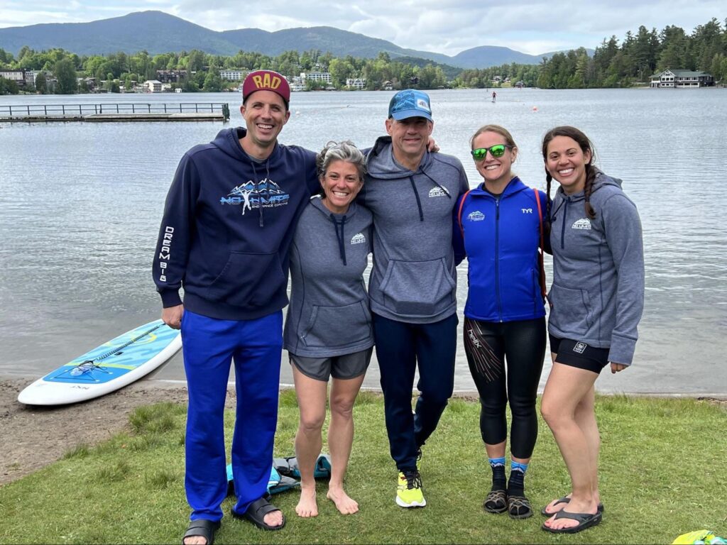 the author and four of her camp coaches on the shore of Lake Placid after a training camp