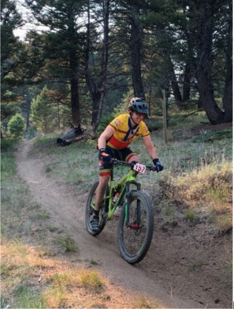 Joe Hamilton Mountain Biking On A Trail In The Woods